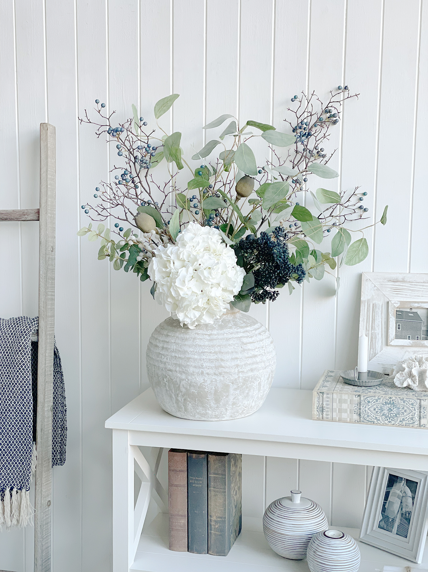 Newfave stone vase with a faux bouquet of Eucalyptus, Poppies, white Hydrangea and blue berries